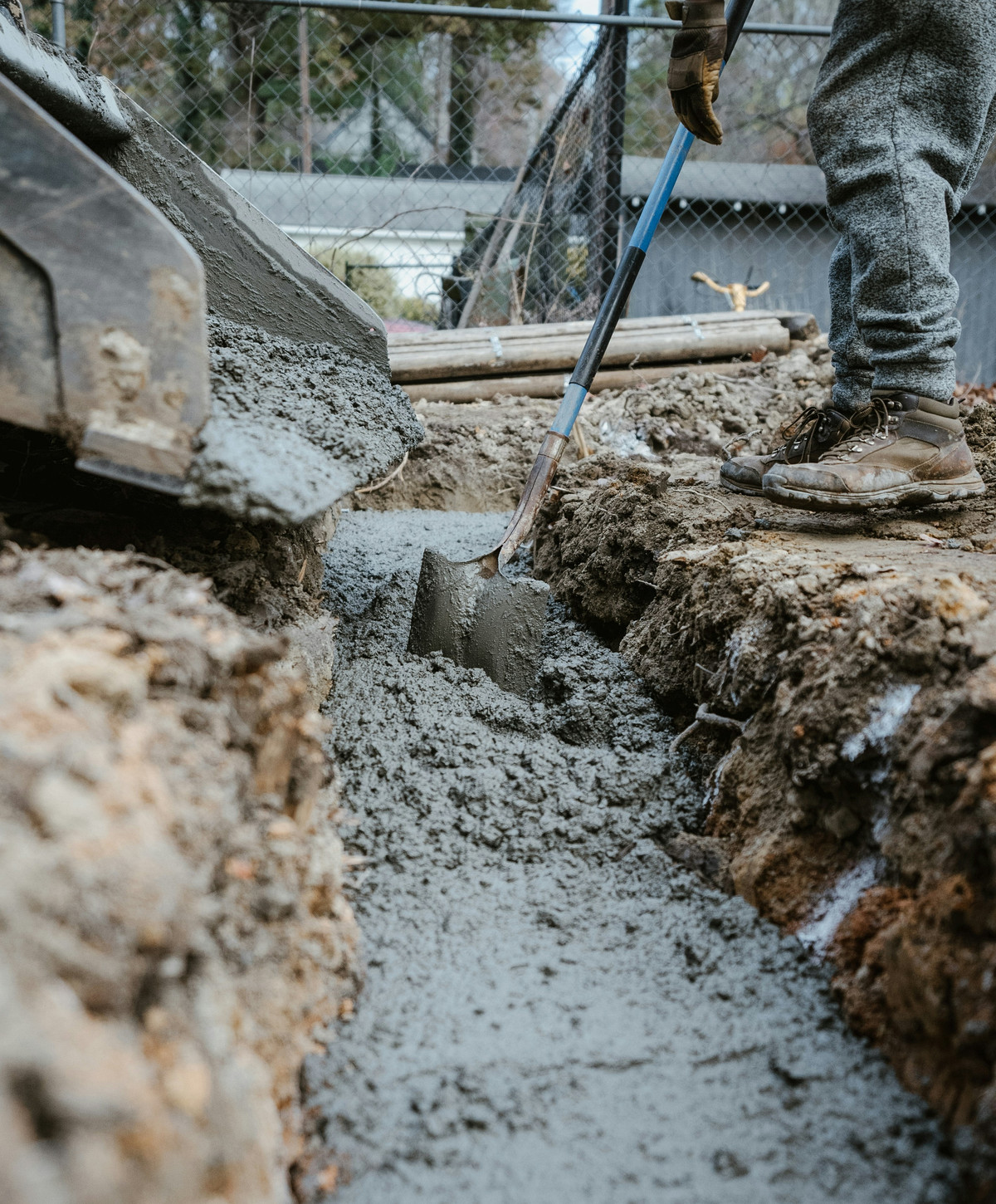 Concrete foundation trench being poured
