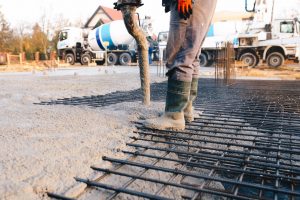 Concrete worker laying a foundation for a business in Ocala